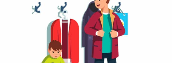 スペインの洋服ラックの前に立つ男性と子供。