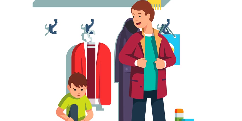 スペインの洋服ラックの前に立つ男性と子供。