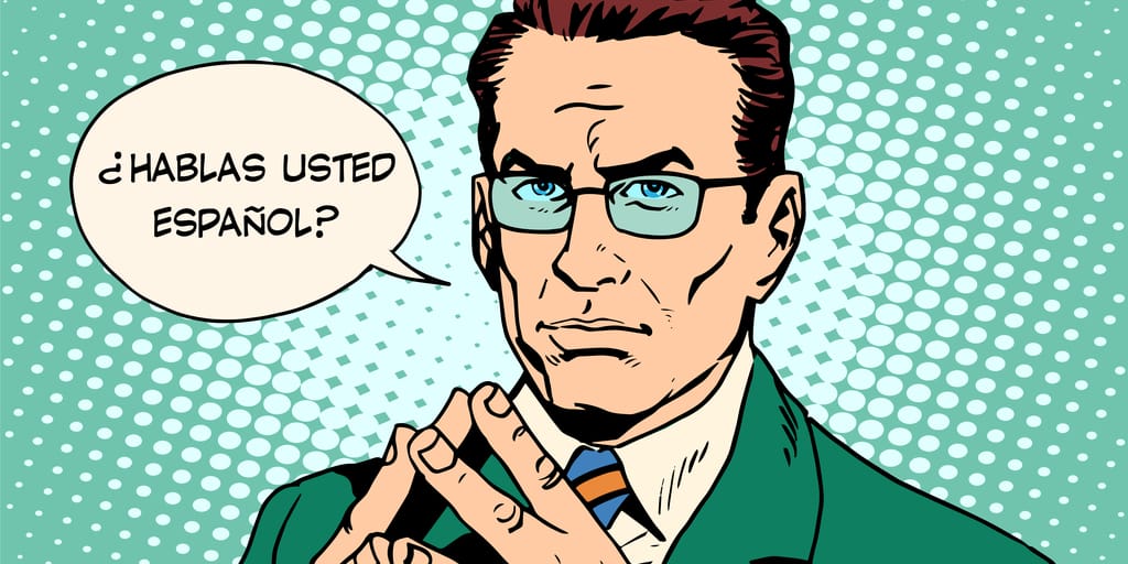 メガネをかけた男性とスペインと書かれた吹き出し。